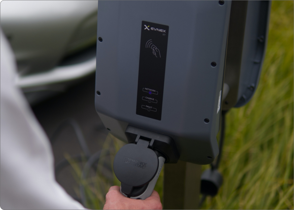 Electric vehicle owner charging their vehicle using an EV charger installed by Prairie Electric in Vancouver, WA.