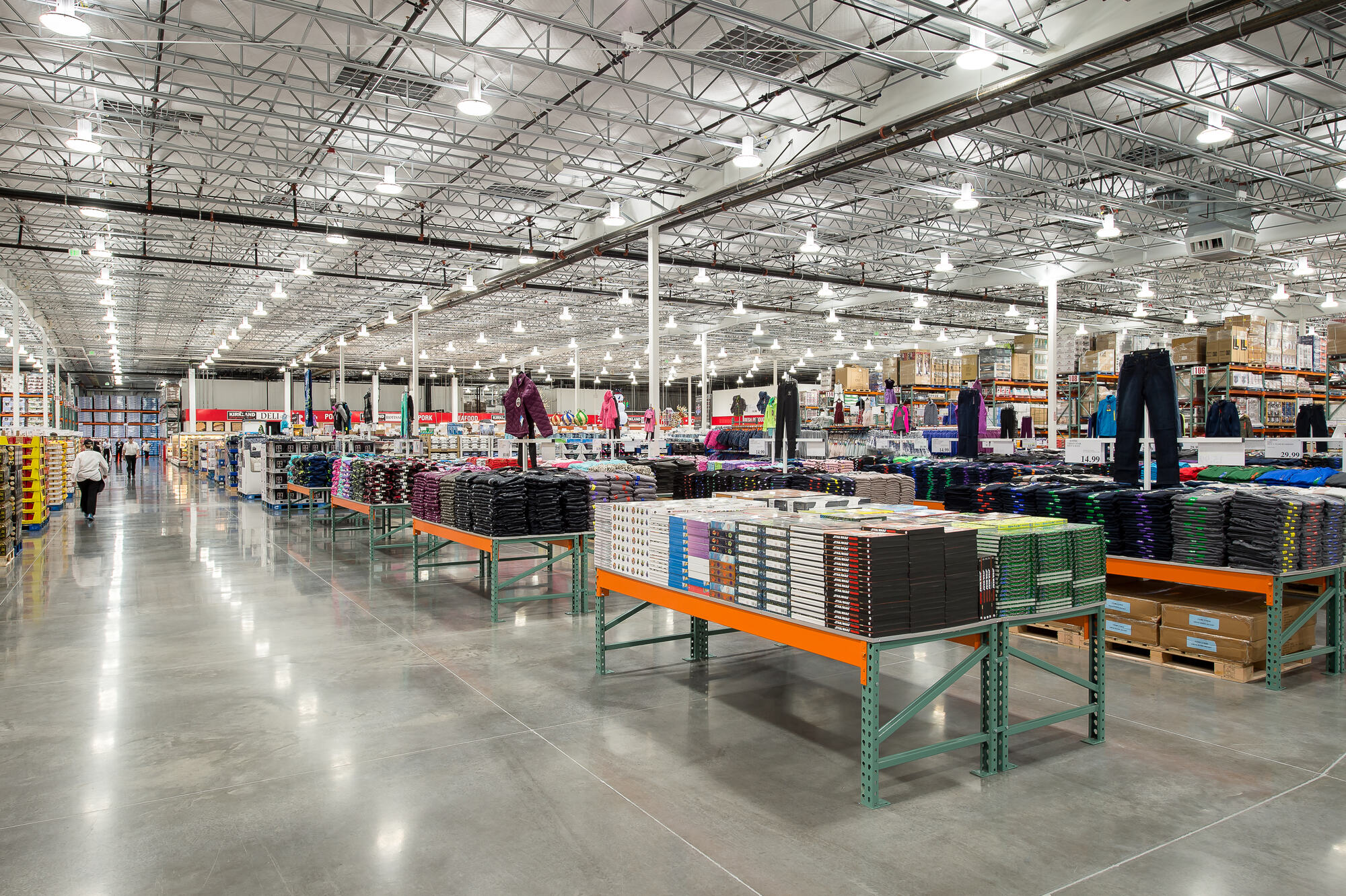 The Costco Warehouse in Bellingham, WA, features a well-lit interior with numerous overhead lights illuminating the shelves. For professional electrician services in Vancouver, WA, contact our experts to ensure efficient and safe lighting installations.