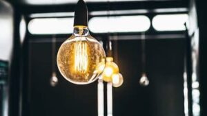 Hanging light bulb shows visible sign of power surges